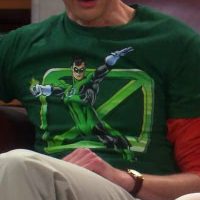 Sheldon wearing Green Lantern Flying X shirt