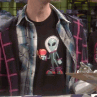 Stuart wearing Lil Alien shirt