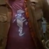 Leonard wearing Little Timmy shirt