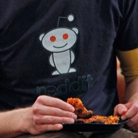 Sheldon wearing Reddit shirt