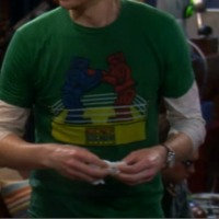 Sheldon wearing Rock em Sock em Robots Shirt